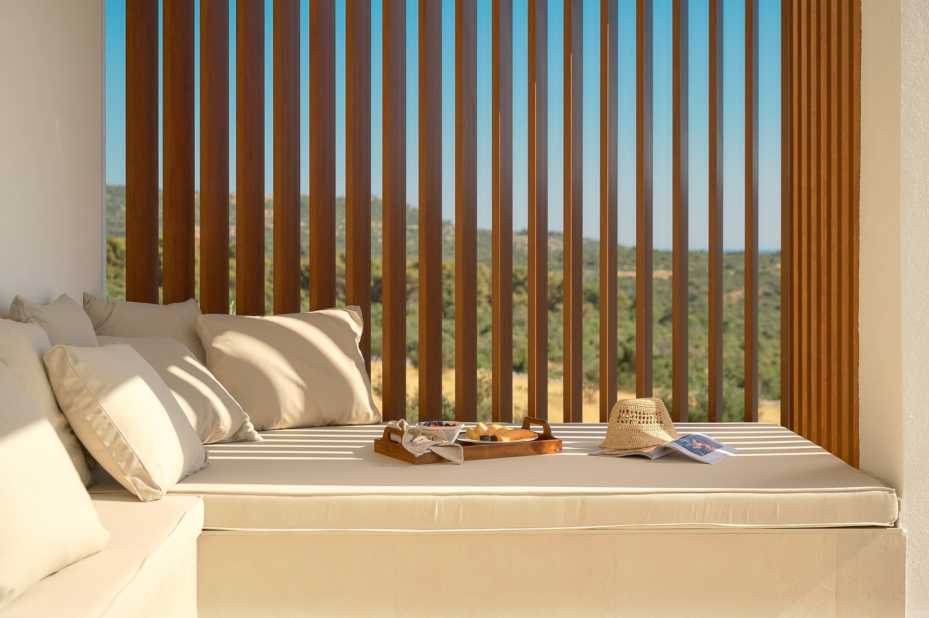 Fully private terrace with a lounge bed surrounded by nature in a private villa in Croatia