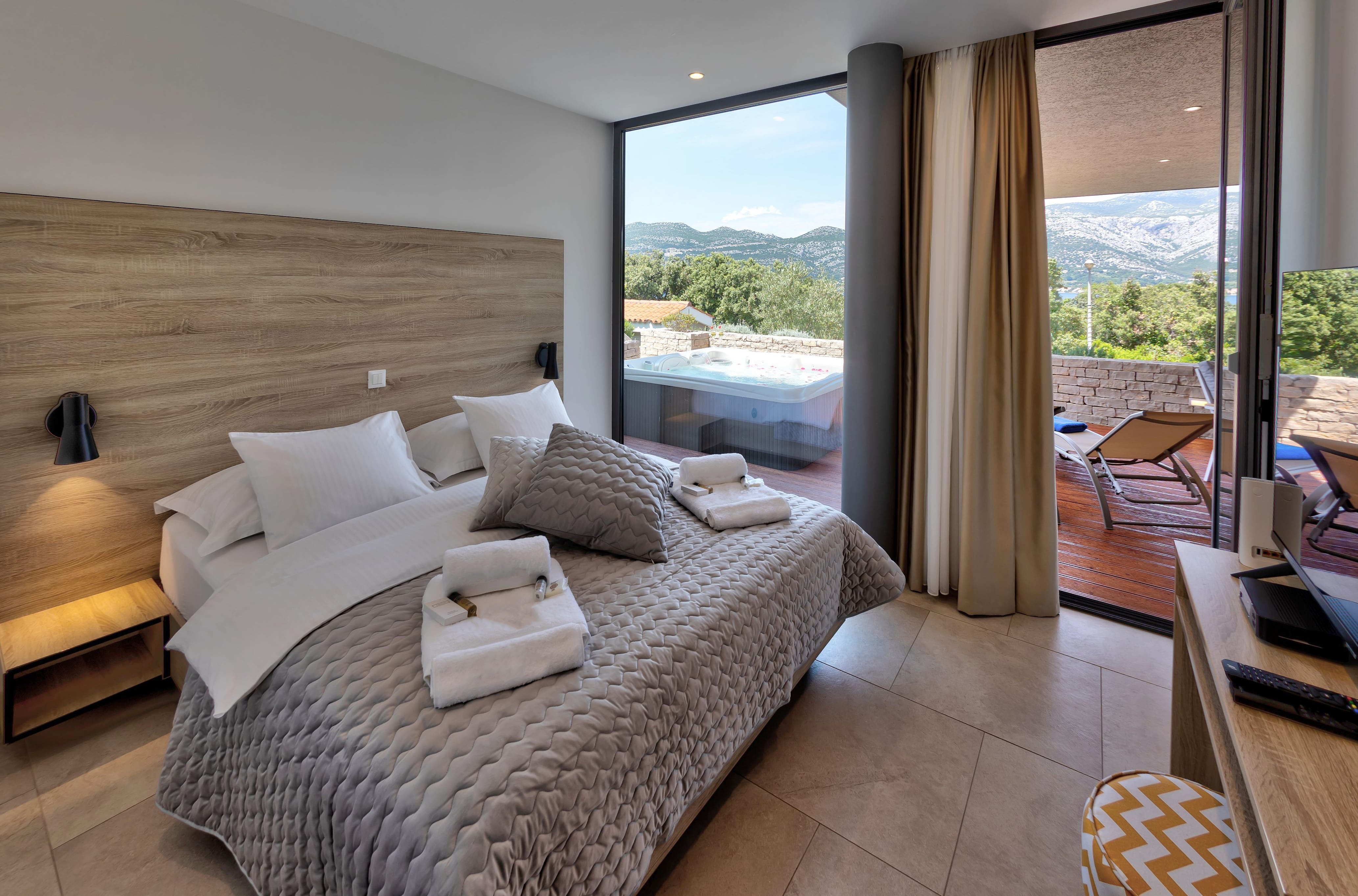 Modern bedroom with a double bed in Villa Superior Two on Korcula 