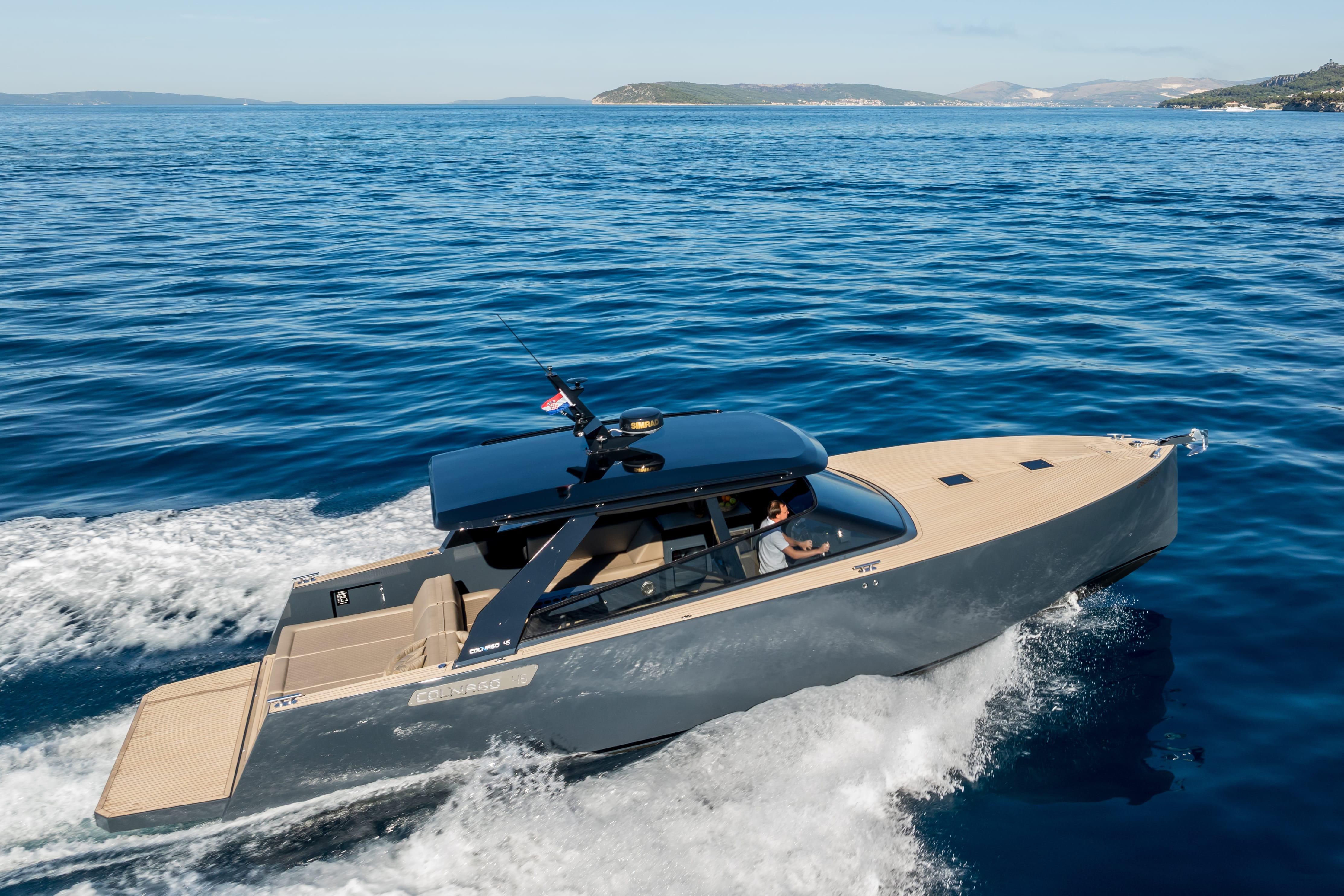 Luxury Colnago 45A navigating through blue waters with a clear sky.