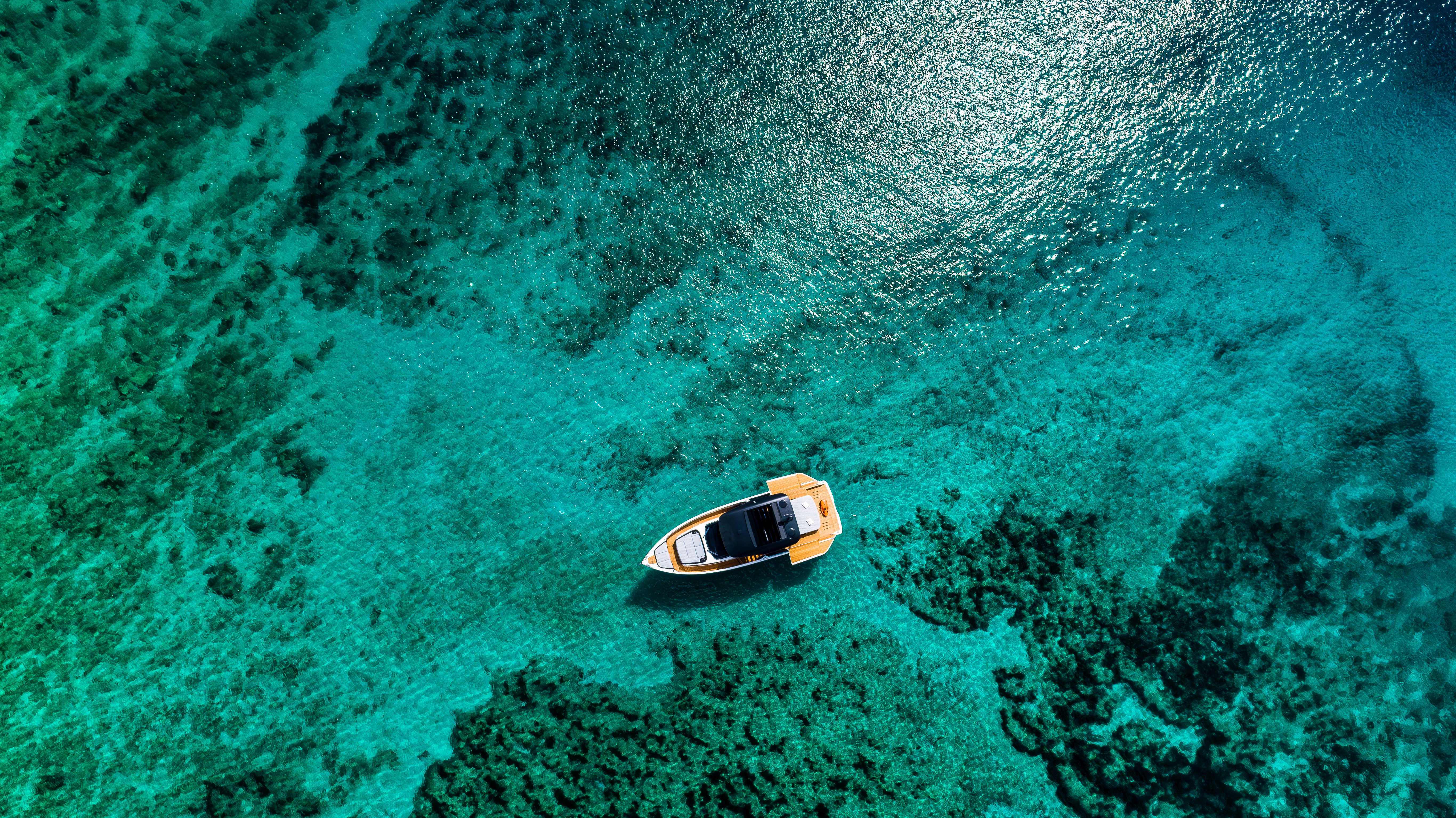 Aerial view of Cranchi A46 luxury tender on clear turquoise water.