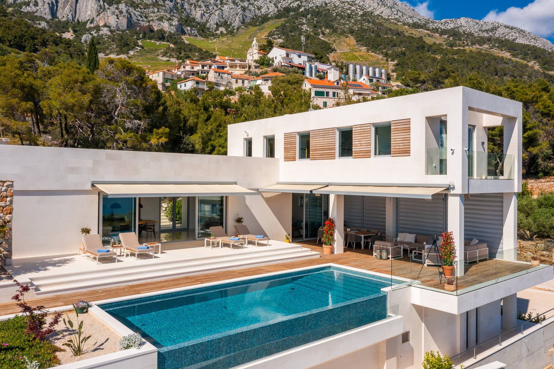 Modern luxury villa with a pool, offering stunning mountain and sea views on the island of Hvar