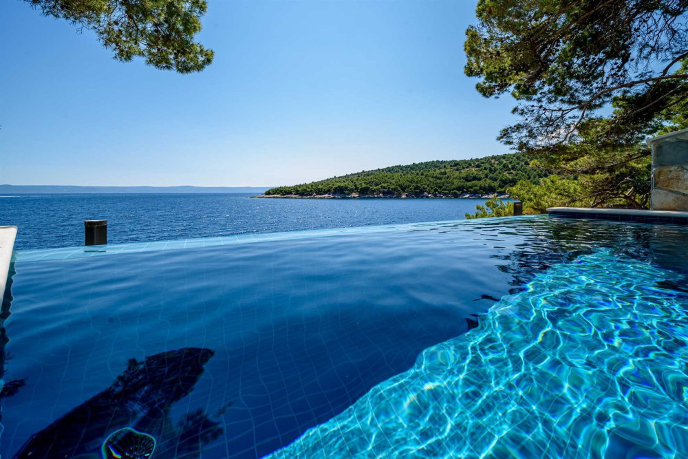 Beachfront villa Jewel Brac with heated pool