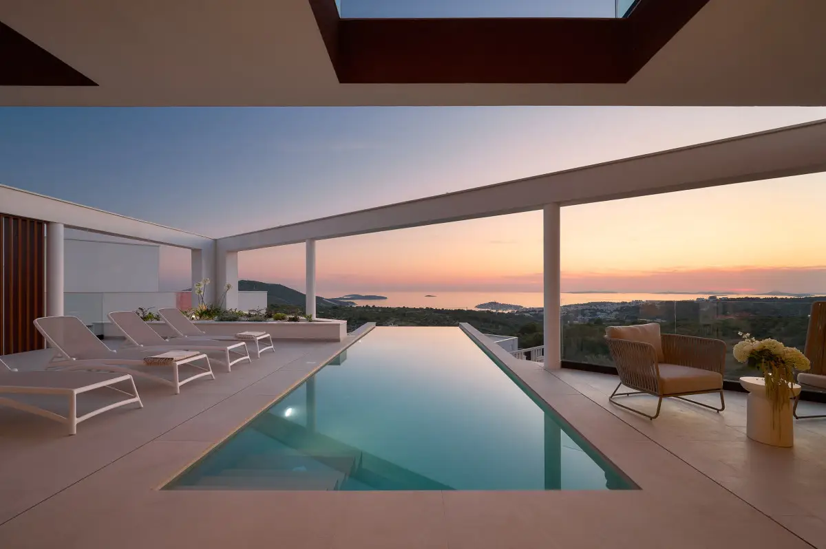 Sunset view of the sea from the terrace of a luxury villa in Primosten with infinity pool