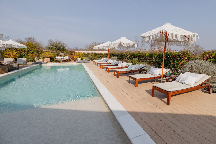 Stunning pool with sun beds next to it on a terrace of a beautiful villa in Istria