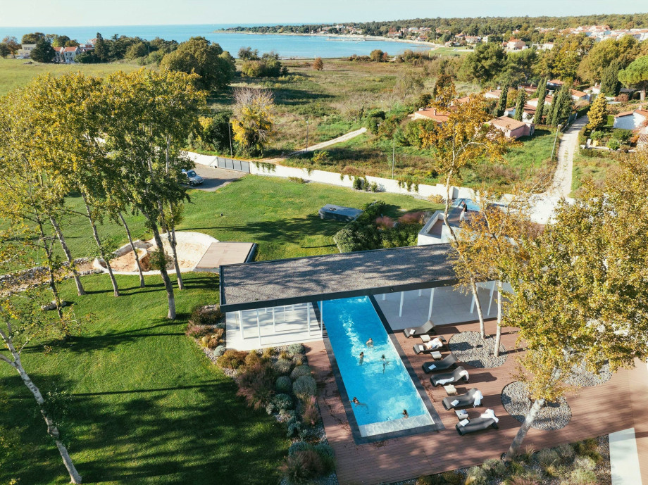 Aerial view of a luxury villa in Istria with heated pool, and large garden