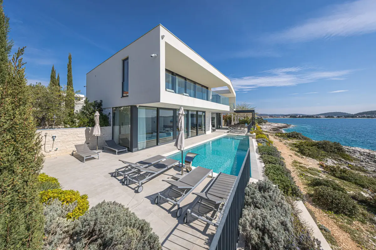 Luxury beachfront villa in Rogoznica with a heated pool